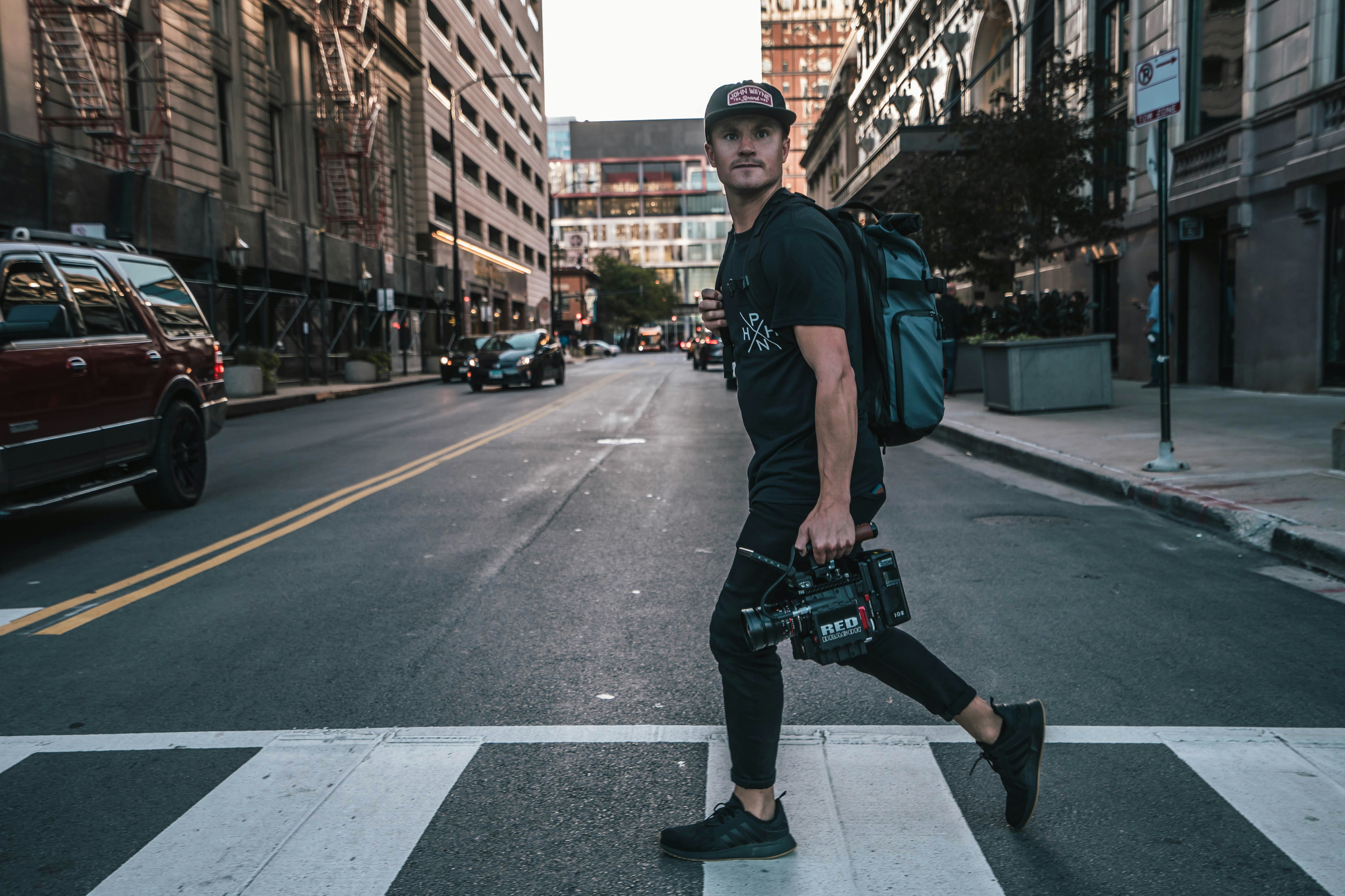 man walking on pedestrian lane